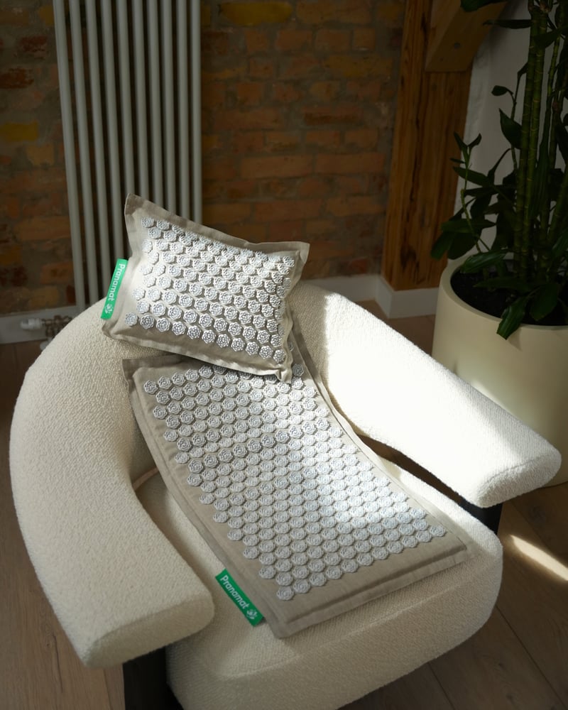 Ivory Pranamat set on a cream lounge chair