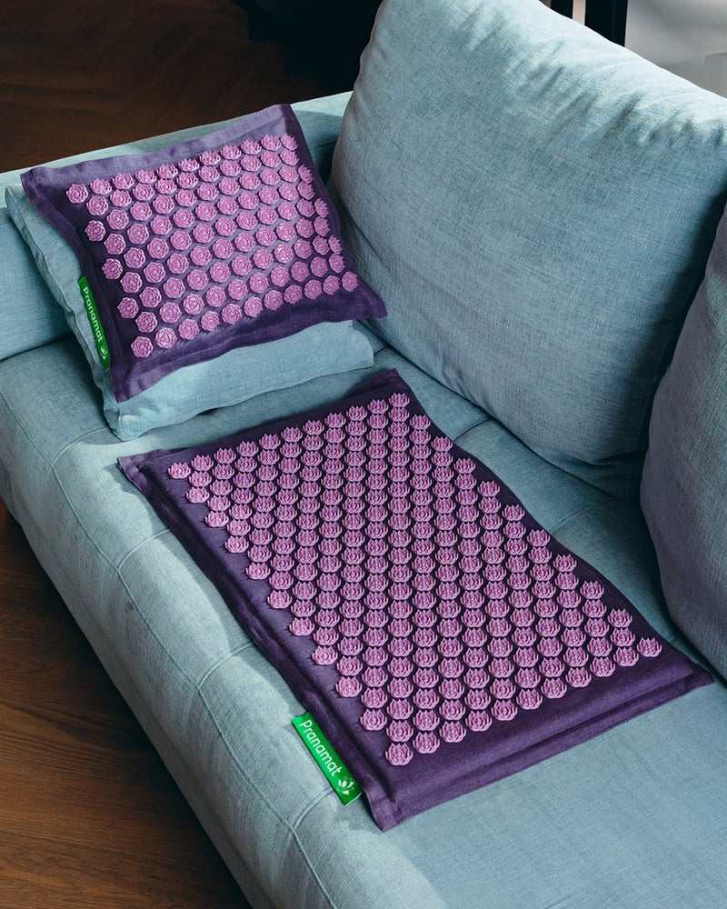 Lavender Pranamat set on a pale blue armchair