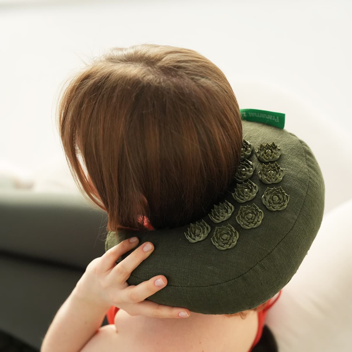 Olive Moon pillow around the neck